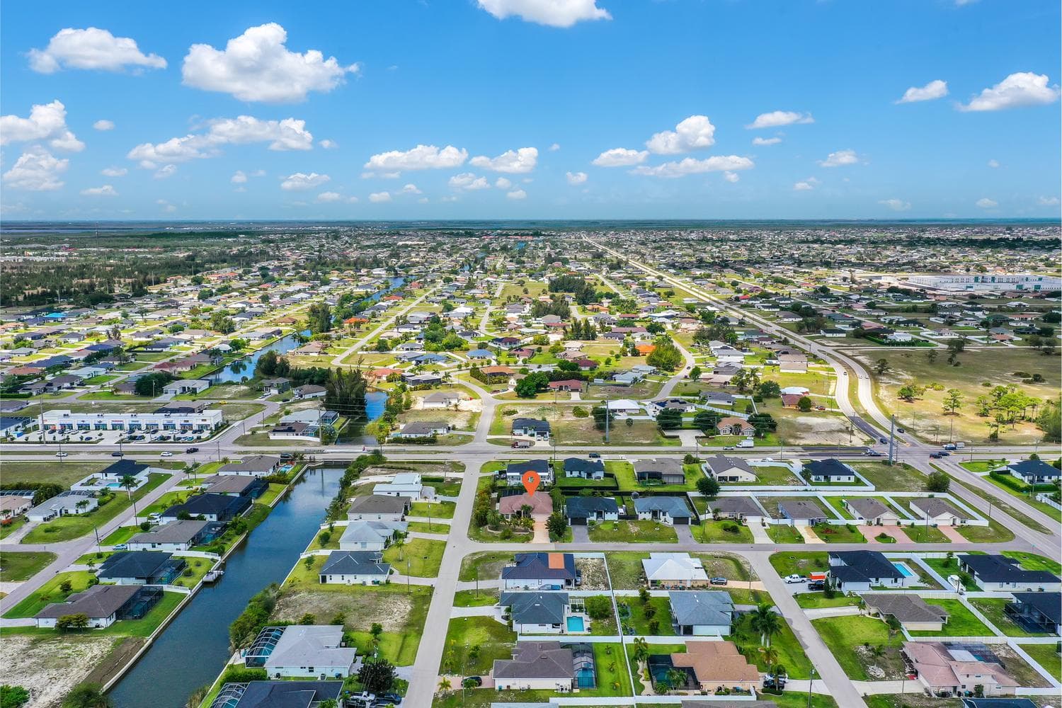 Aerial view of Cape Coral neighborhoods with canals and Gulf Coast homes